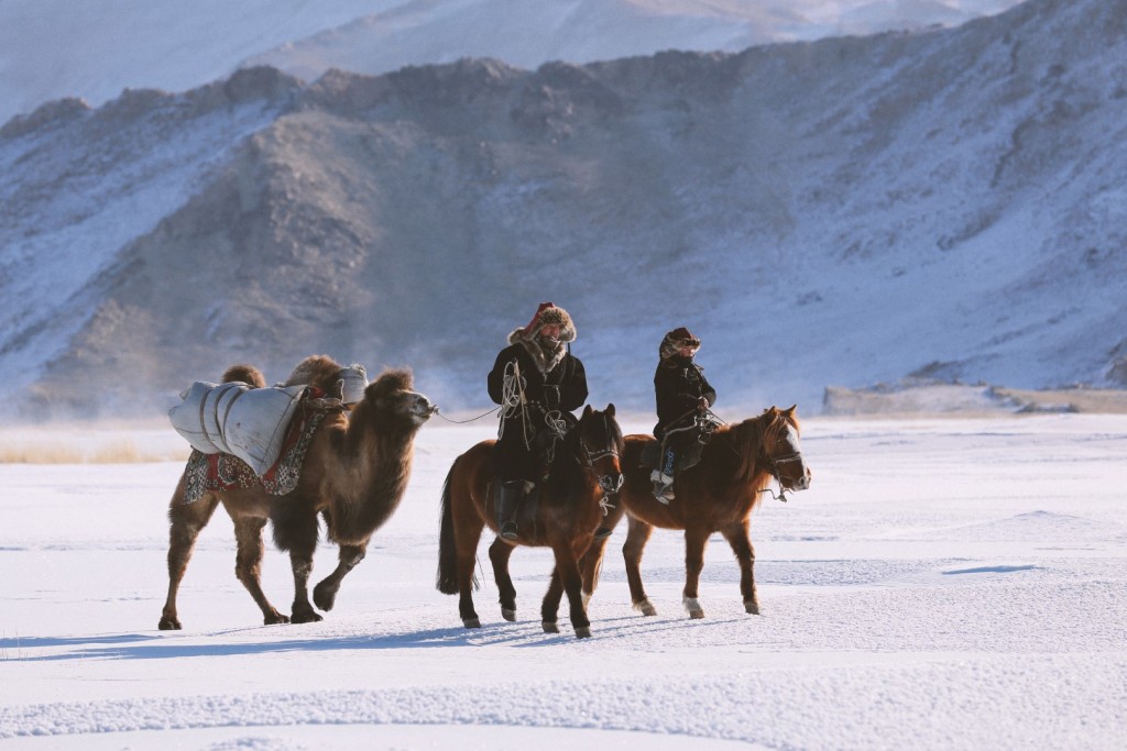 Auez (L) and his son Janibek, starting the winter migration in the Mongolia's Altai Mountains_BOY_NOMAD_Niobe_Thompson